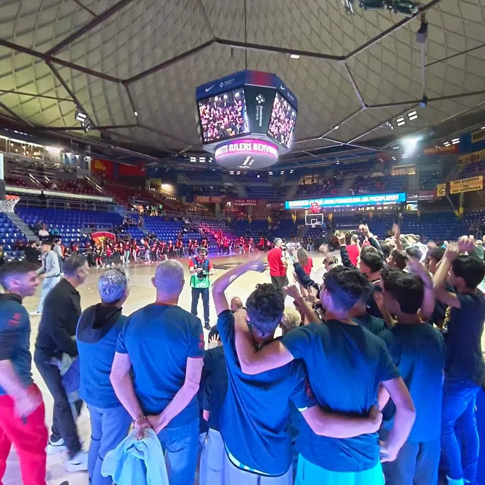 Teams gathered on court under the arena screen at the opening ceremony