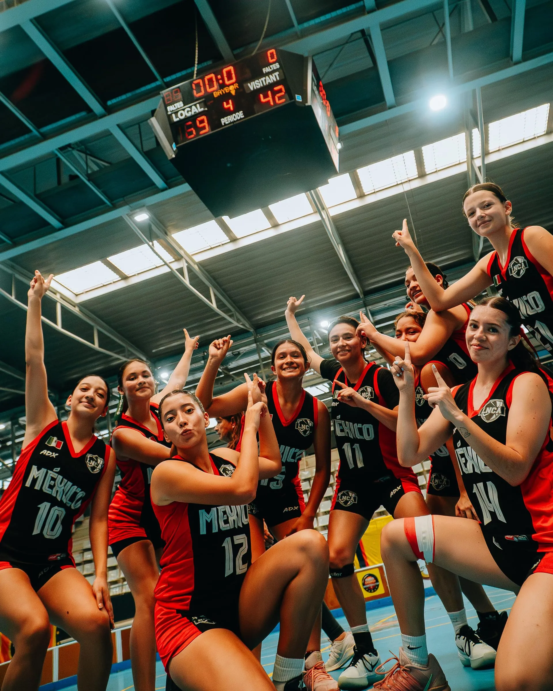 A team celebrating together on court after their win